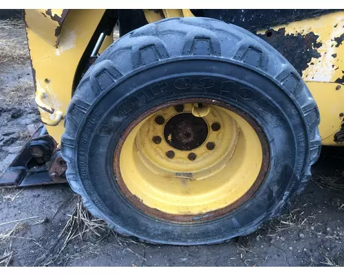 CAT 226D Equip Tire and Rim