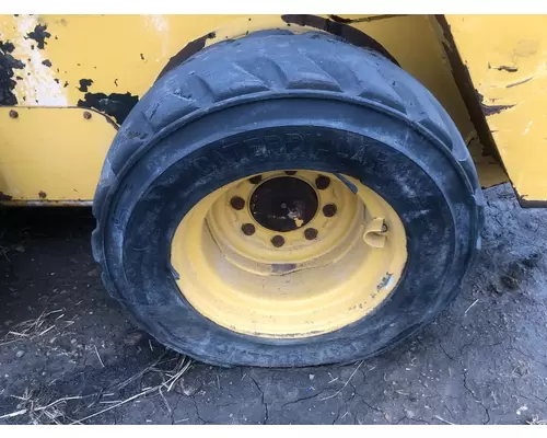 CAT 226D Equip Tire and Rim