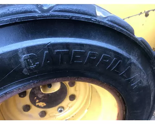 CAT 226D Equip Tire and Rim