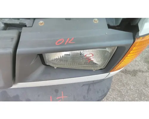 FORD E350 HEADLAMP BEZEL